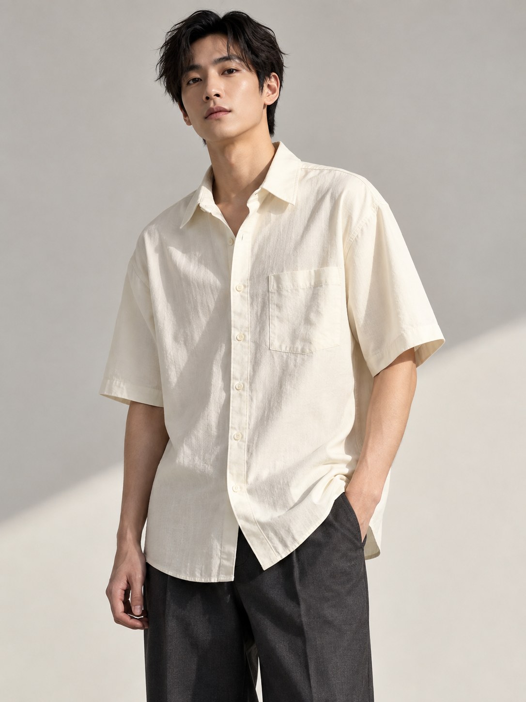 Adult male model in an ivory cotton short-sleeve shirt